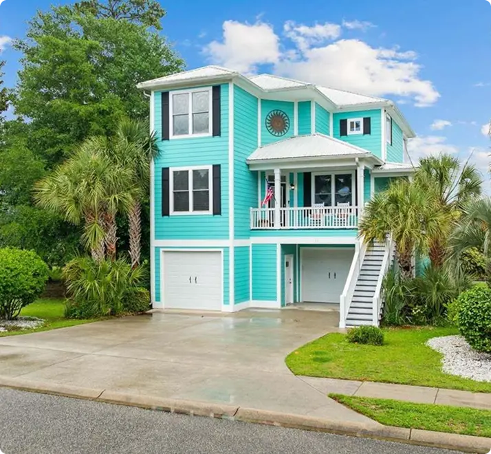 A blue house featuring white siding