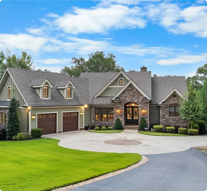 A charming home featuring a driveway and a garage