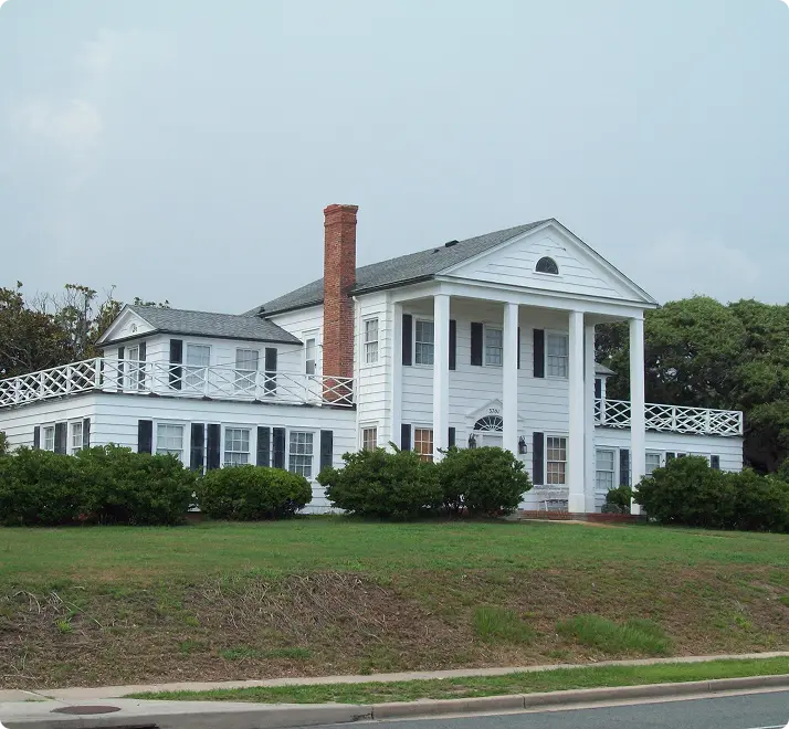 A small house with a spacious yard in front